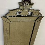 Venetian mirror with floral decoration pediment