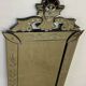 Venetian mirror with floral decoration pediment