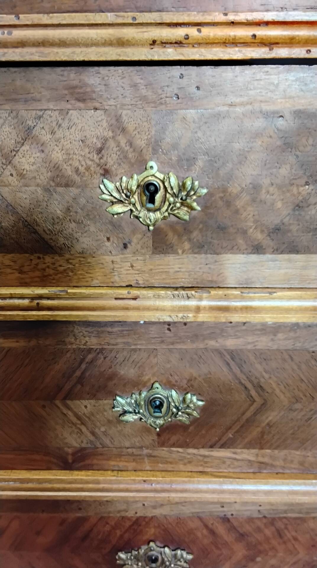 Antique marquetry commode in the Louis XVI style.