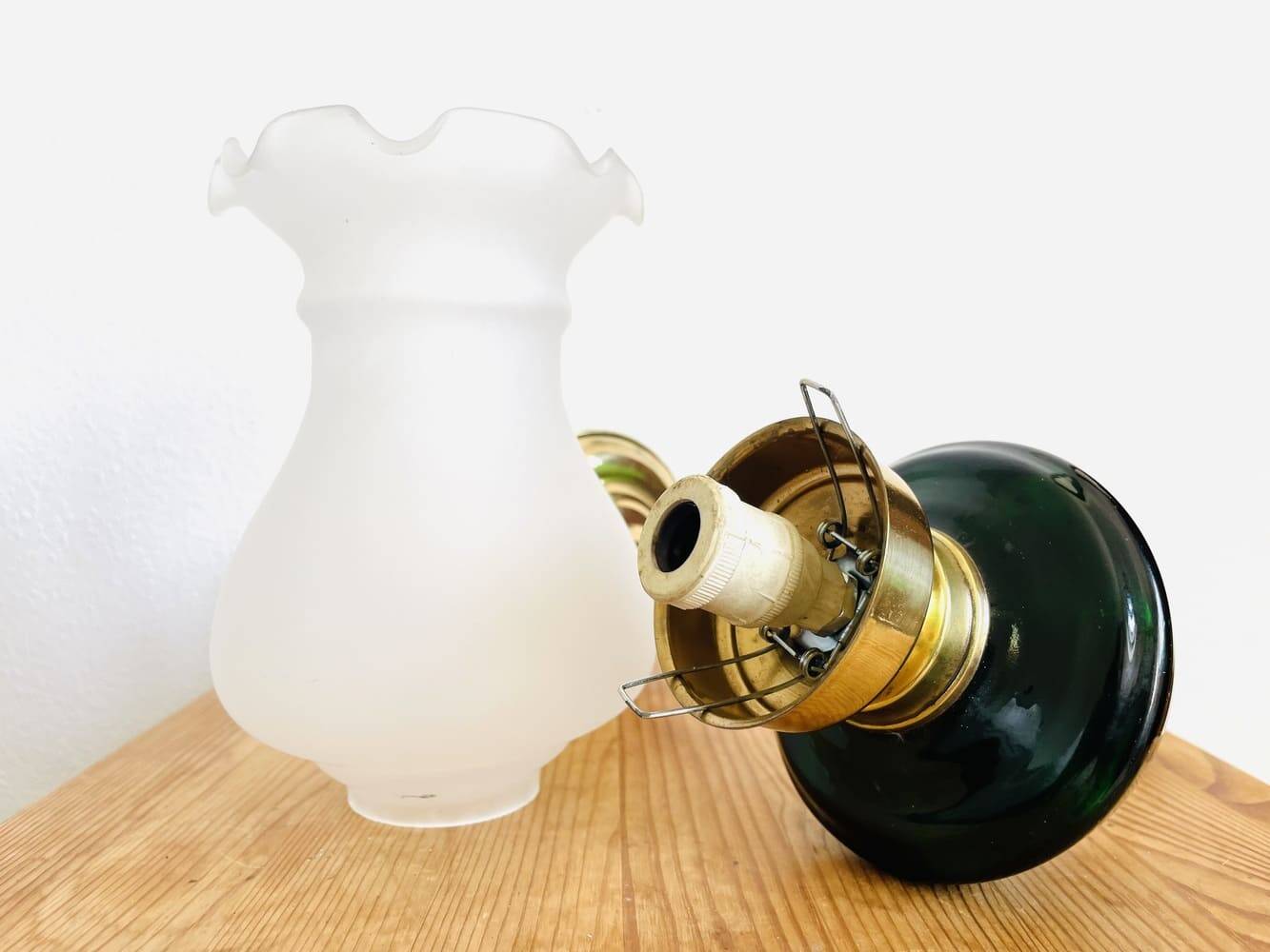 Brass wall sconce with frosted glass tulip lampshade