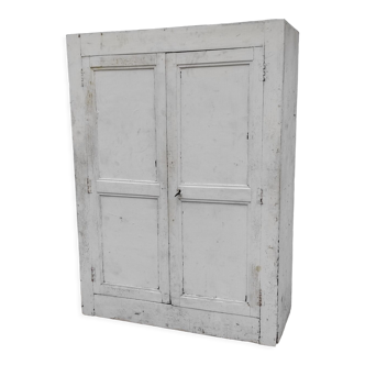 Old rustic Parisian wardrobe patinated white in oak and fir