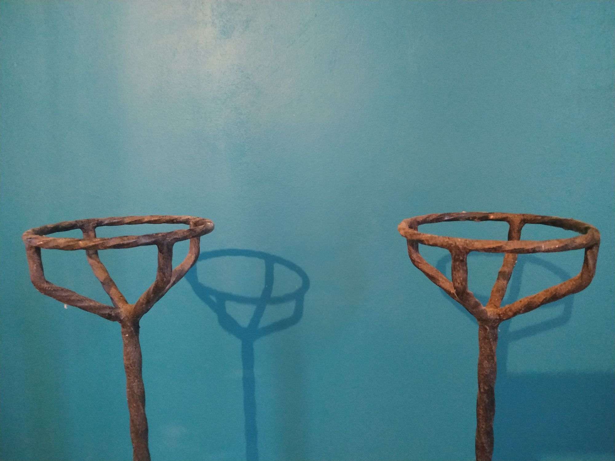 Old pair of wrought iron chimney landiers