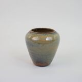 Small beige glazed ceramic vase with abstract relief pattern