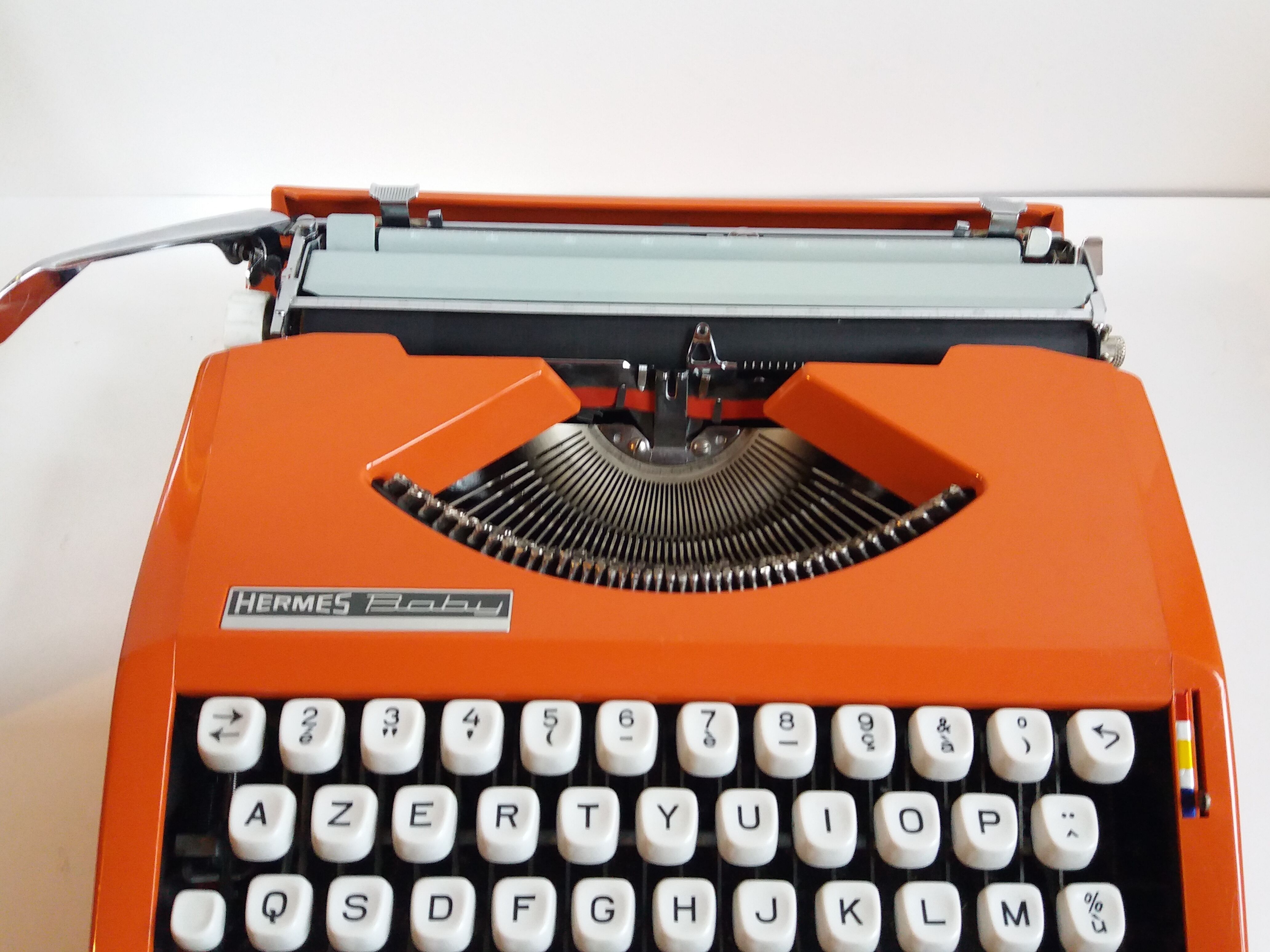 Hermes Baby orange typewriter