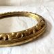 Small vintage wall mirror in gold resin
