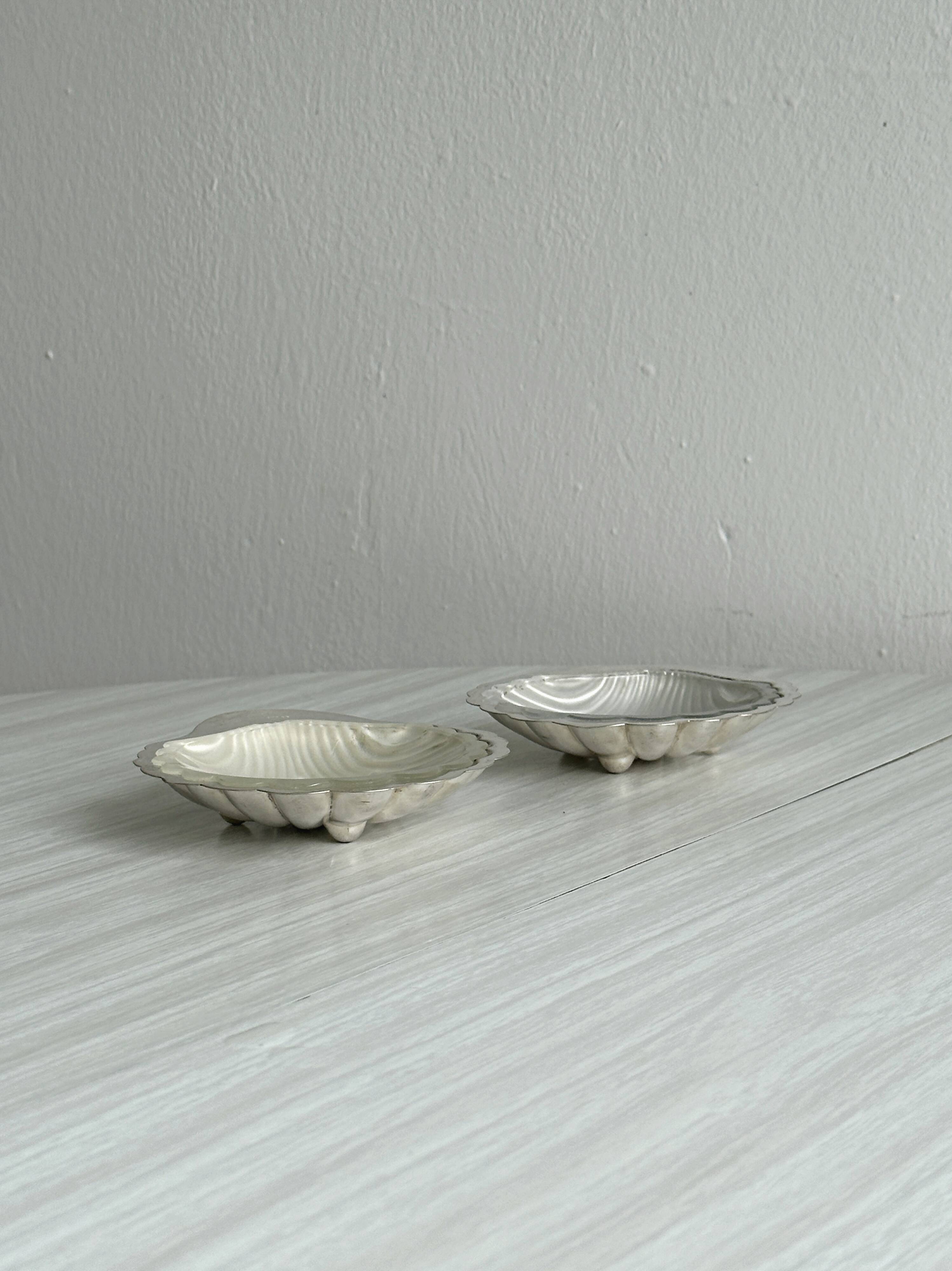 Pair of silver shell bowls