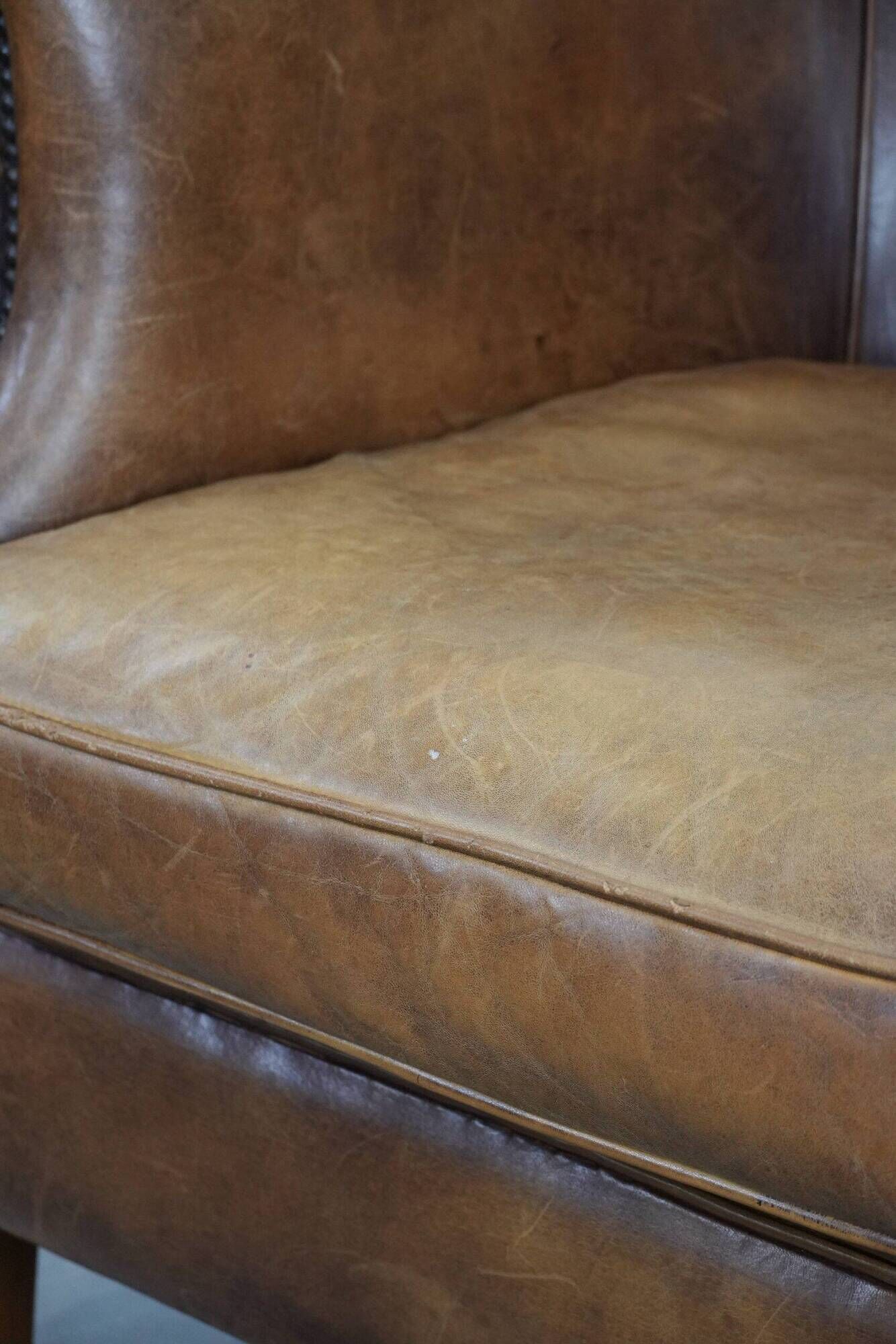 Comfortable club chair made of sheepskin leather
