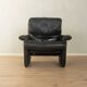 1980s cor armchair and ottoman in black leather