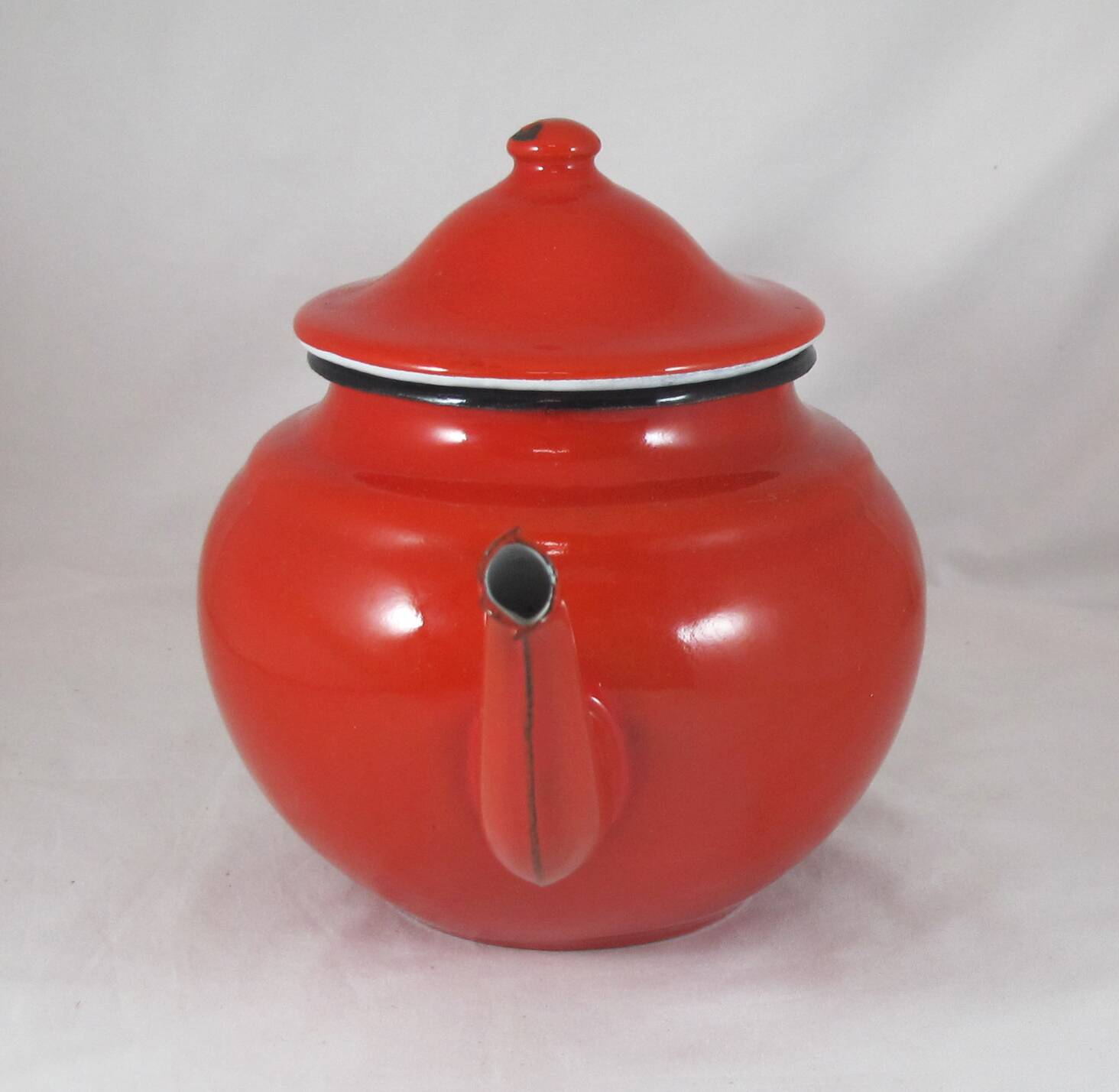Vintage teapot coffee maker in red enameled metal