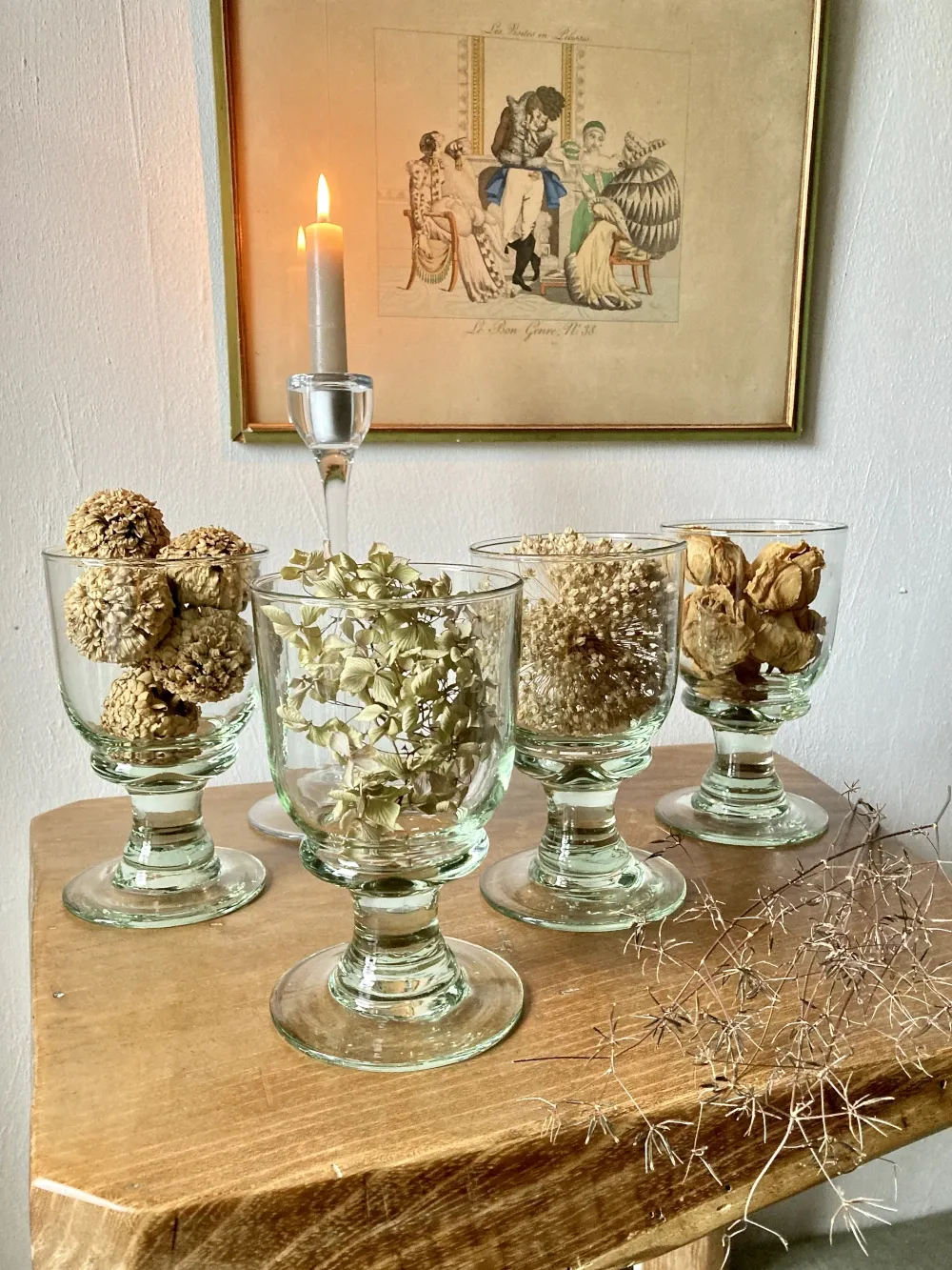 4 stemmed glasses made of handcrafted blown glass in green hue.