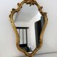 Old golden mirror in composite resin baroque style 60s
