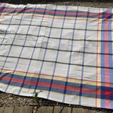 Light gray rectangle tablecloth with blue red yellow tiles