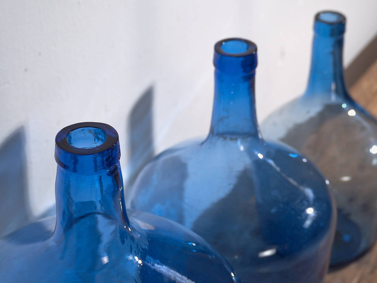 Antique blue demijohns (circa 1920). 3-piece set #1