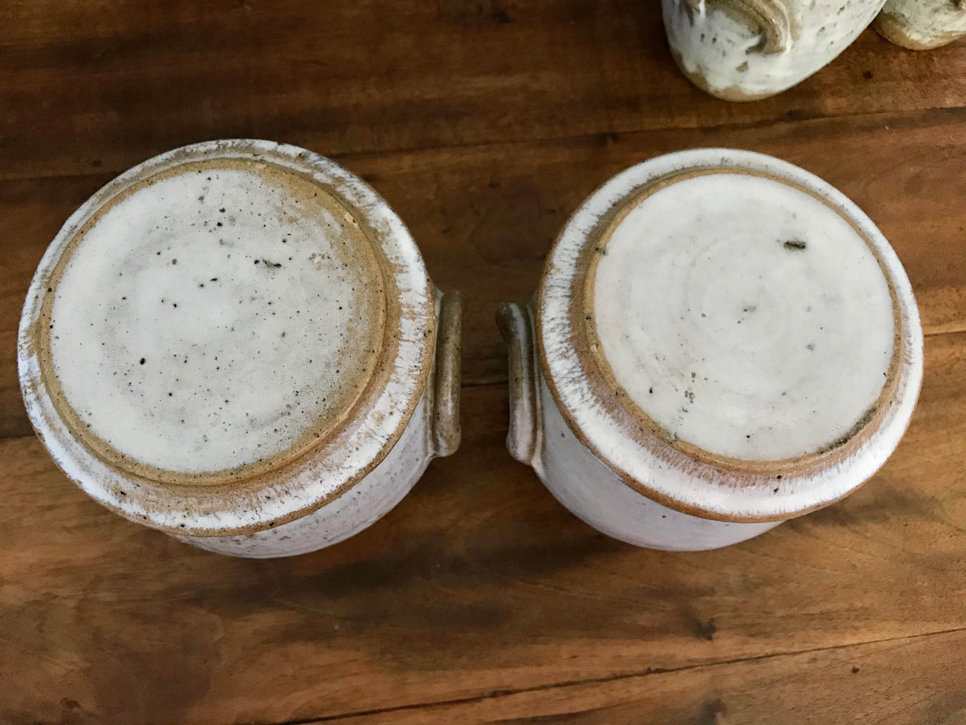 Suite of antique enamelled ceramic pots