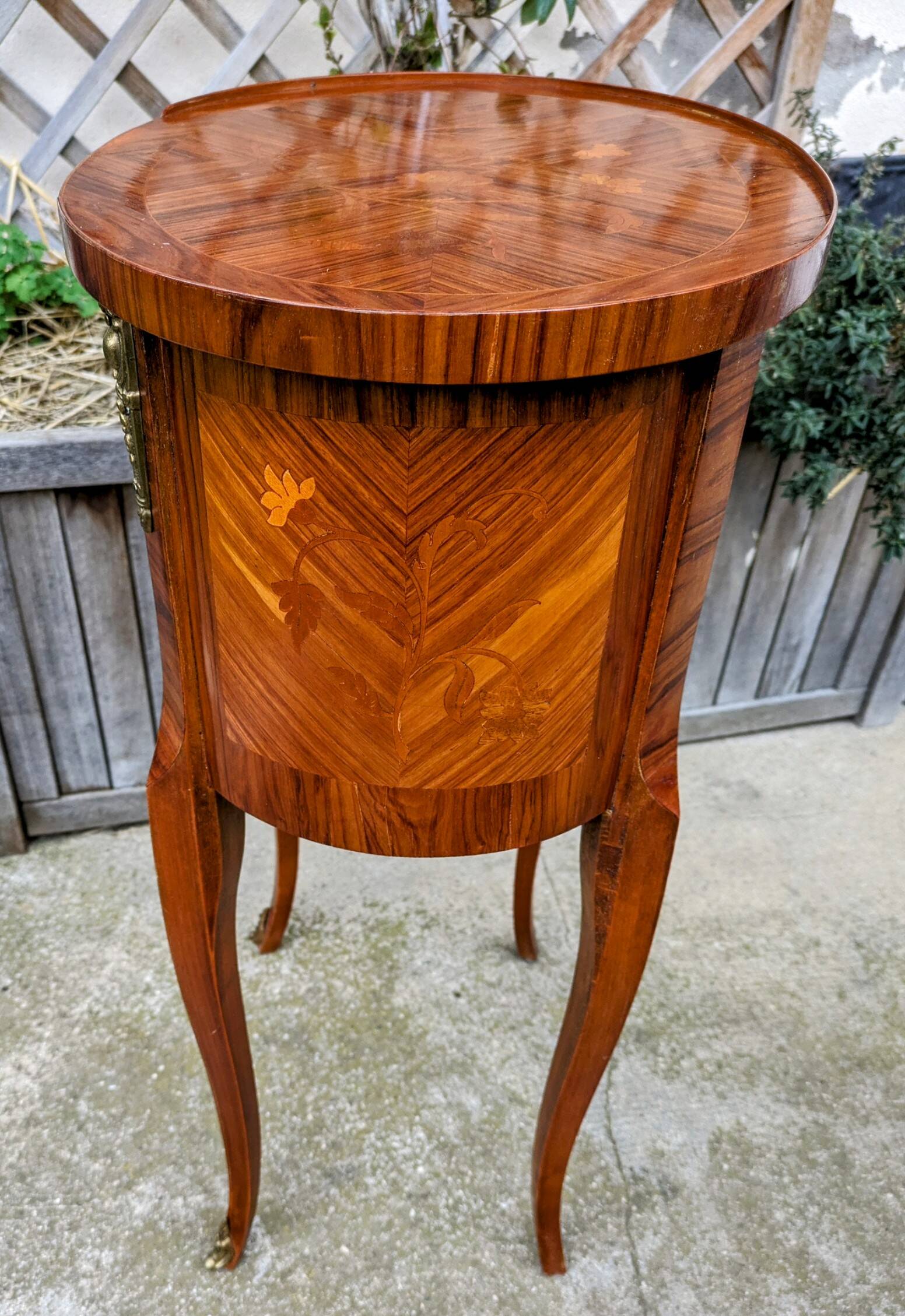 Old oval bedside table in rosewood marquetry Louis XV style