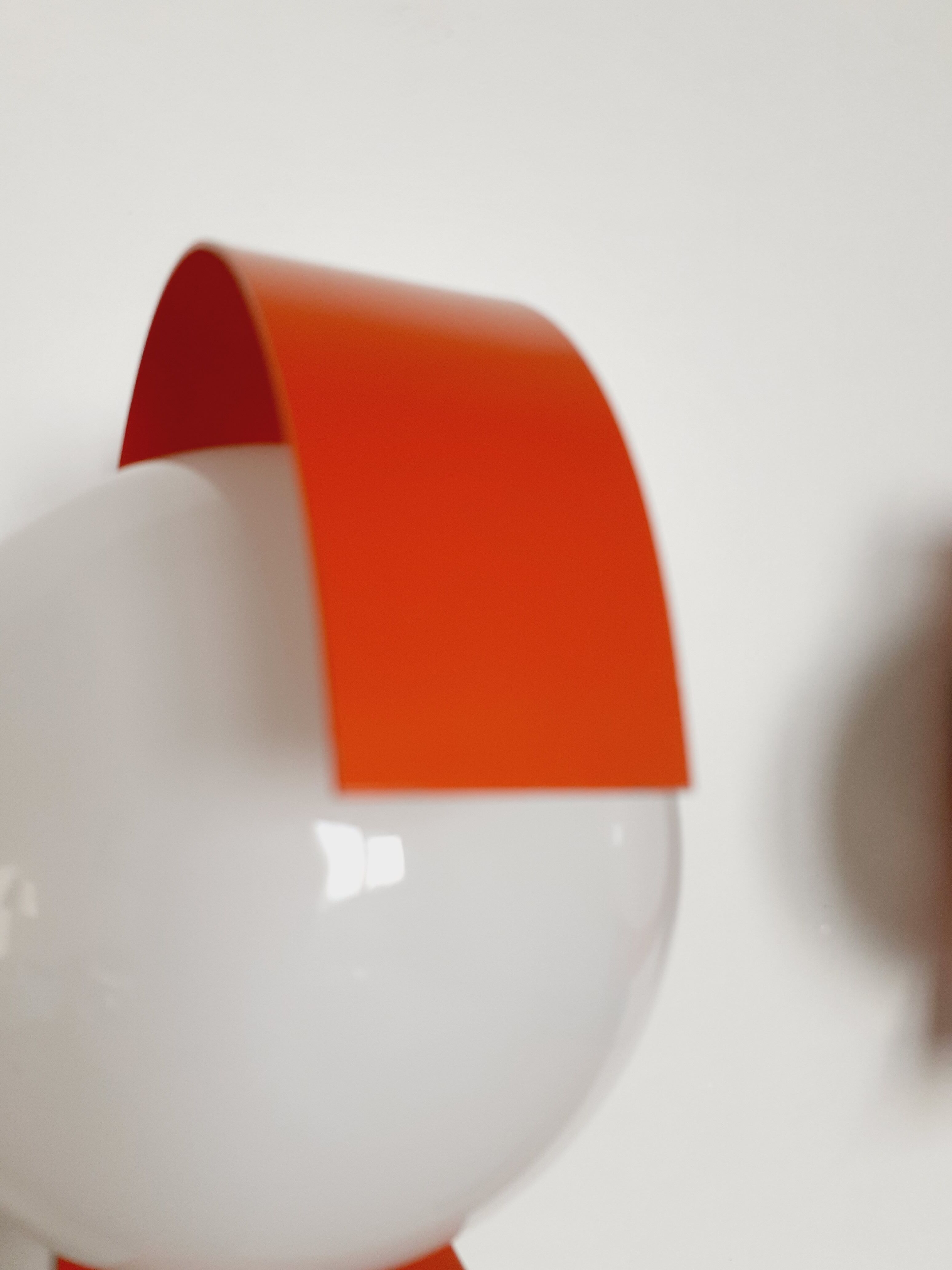 Pair of orange space age wall lamps