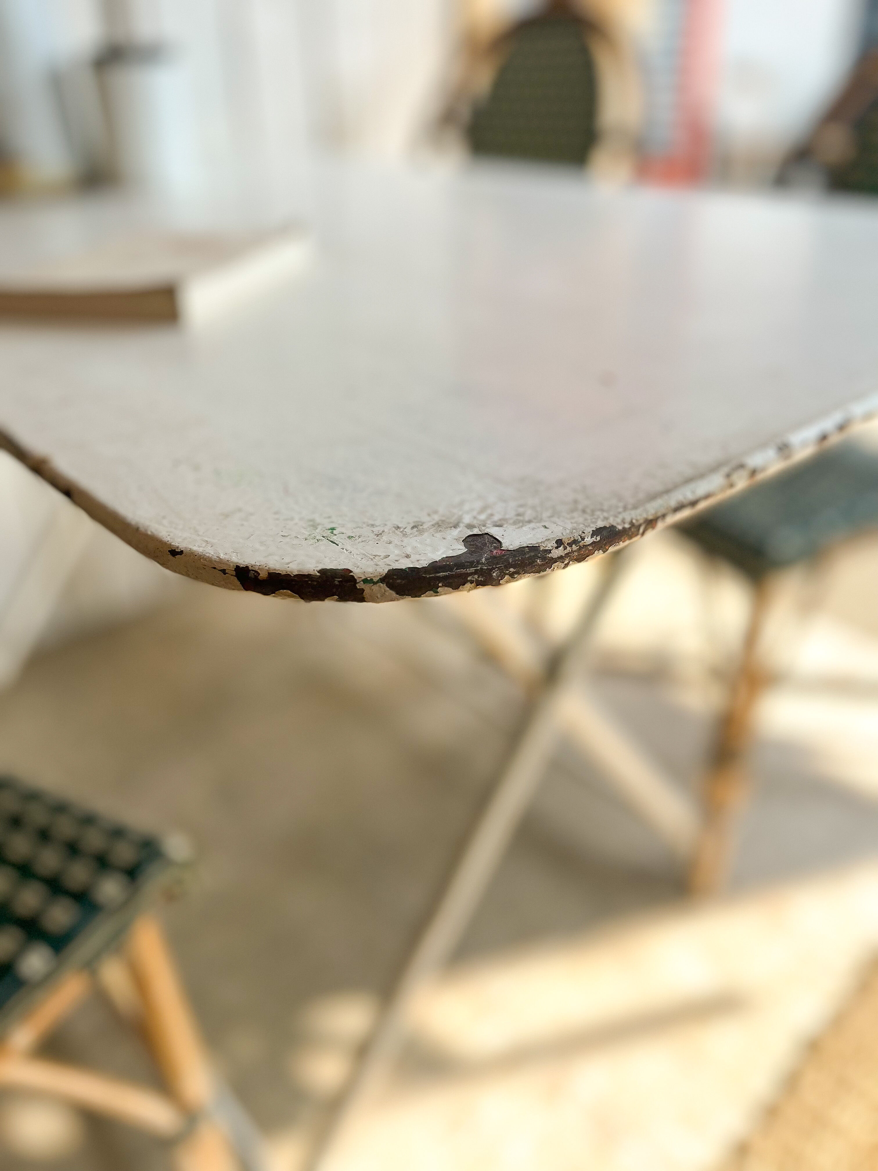 White folding metal bistro table