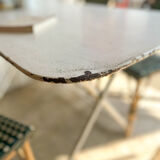 White folding metal bistro table