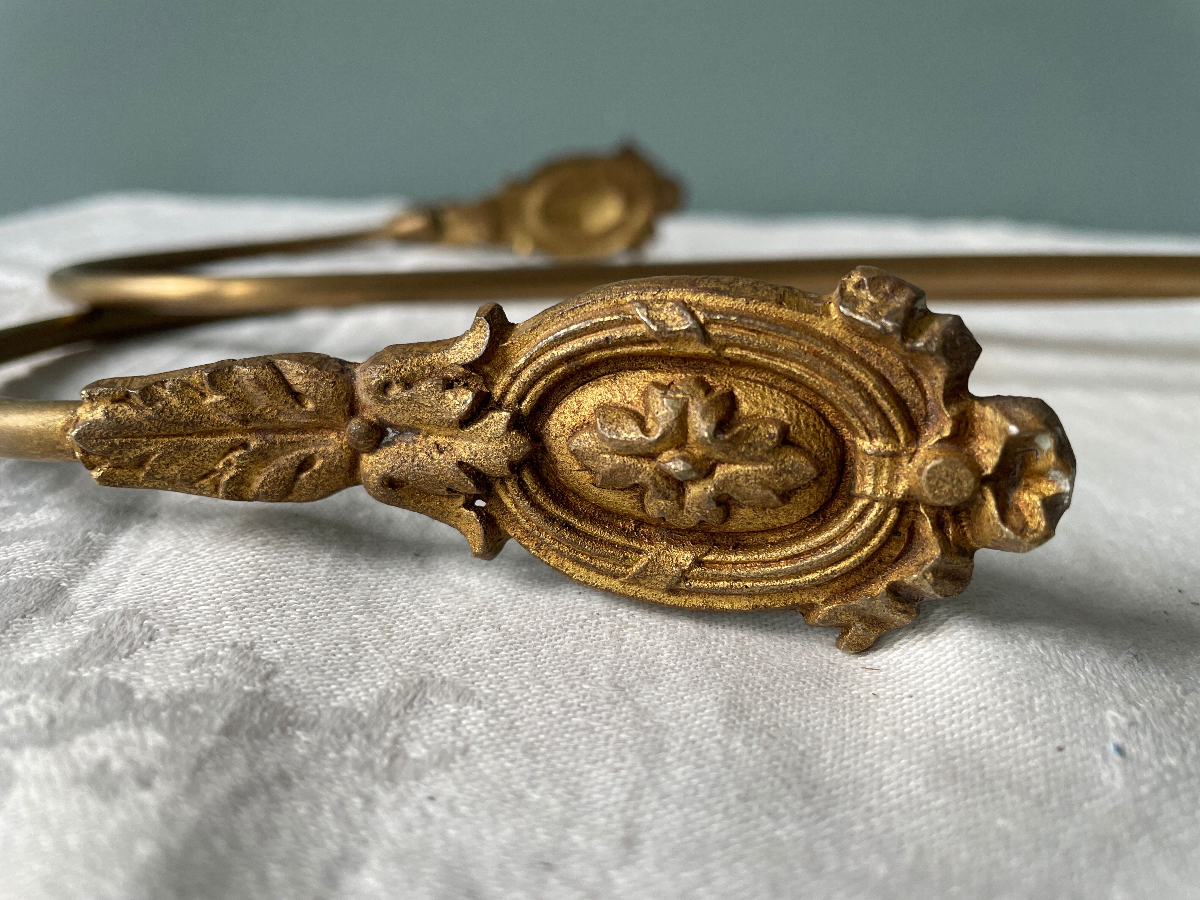 Pair of Napoleon III gilt bronze tiebacks