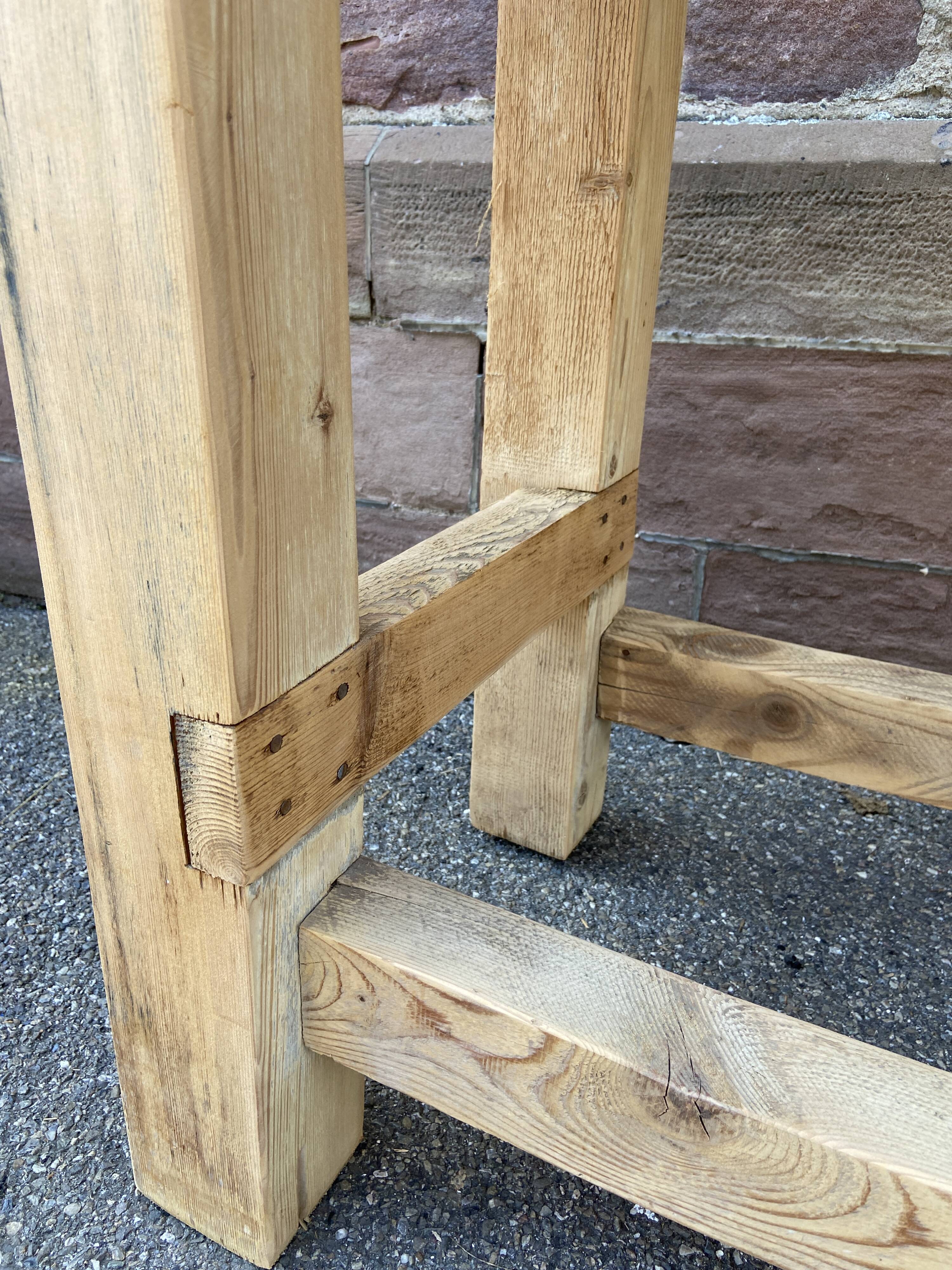 Primitive industrial table workbench in raw natural wood vintage bohemian trade store