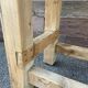 Primitive industrial table workbench in raw natural wood vintage bohemian trade store