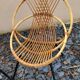 Paire de fauteuils coquilles ou corbeille en rotin tressé, pieds en métal