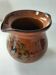 Glazed earthenware pitcher signed HR with a design of stylised birds.