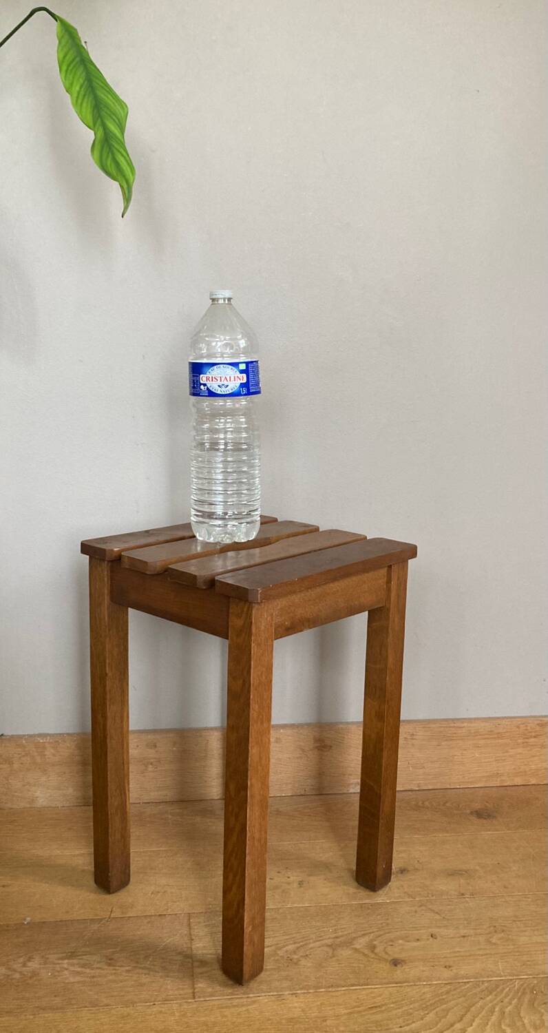 Wooden stool with central grip, quadripod base, 20th century
