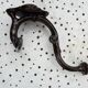 Art Nouveau period coat rack, 1910, in enamelled cast iron, brown