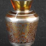 Old small glass vase decorated with silver