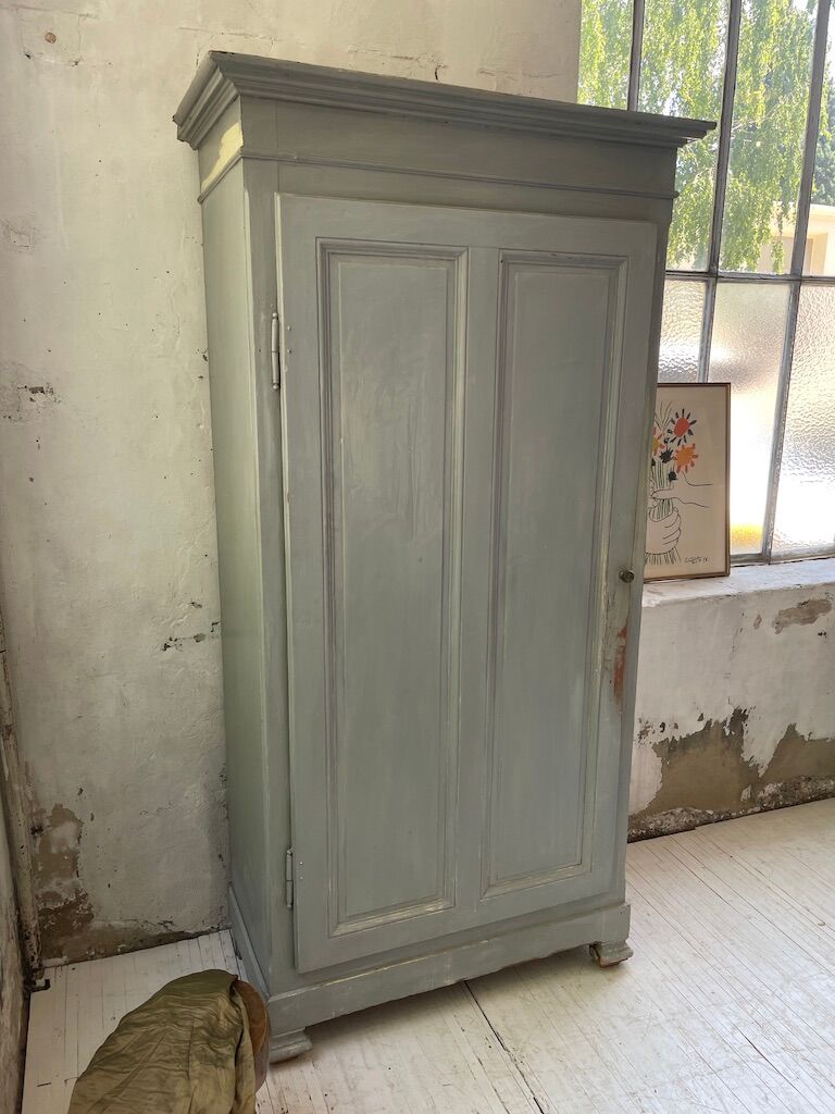 Blue patinated cap cabinet