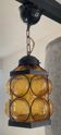 Amber glass and wrought iron suspension from the 1960s.