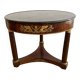 Empire gueridon in mahogany veneer adorned with chiselled and gilded bronze, topped with black marble with a groove.
