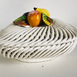 Covered basket in woven ceramic and fruit slip.