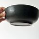 Round vintage black ceramic catchall.