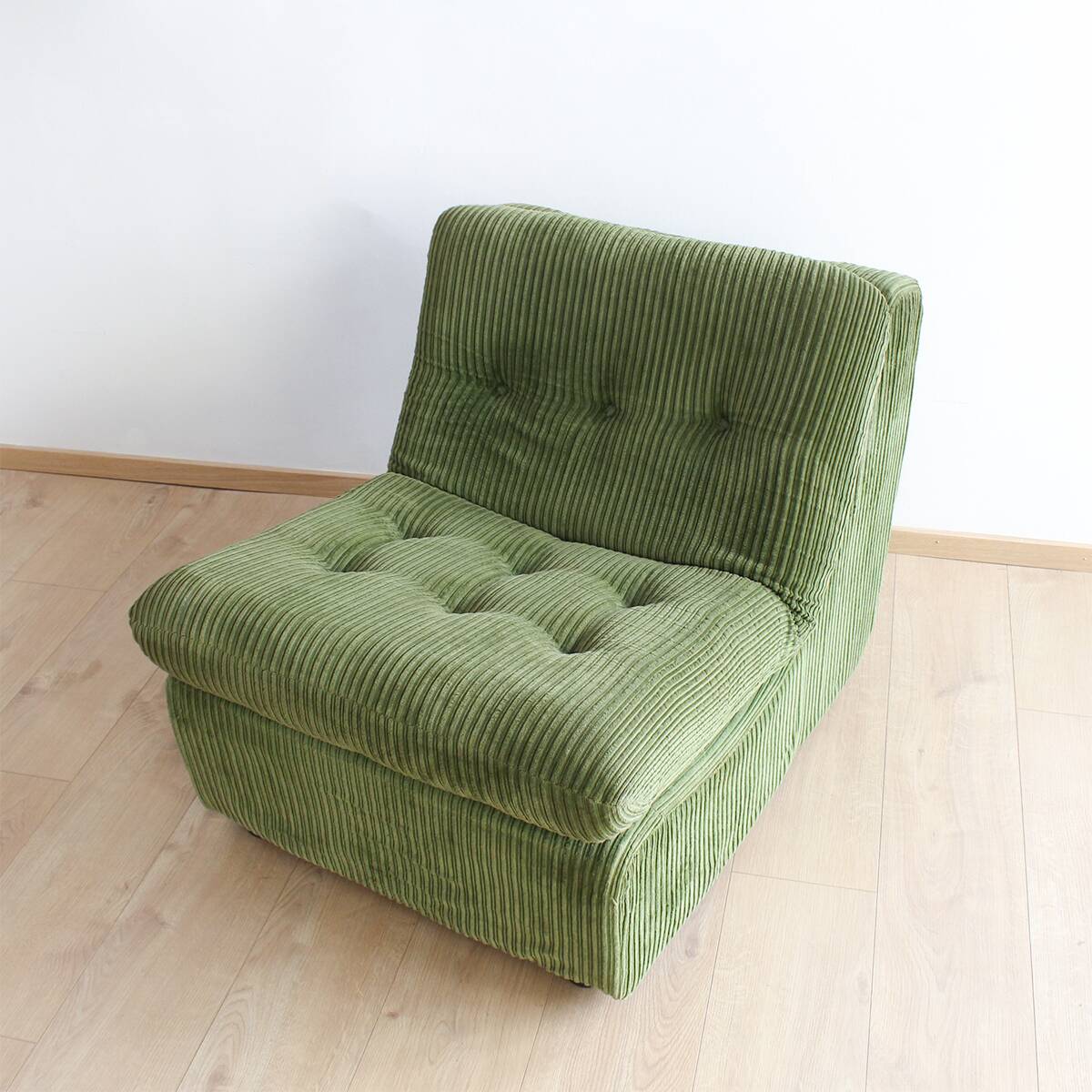 Modular vintage sofa with green cord upholstery