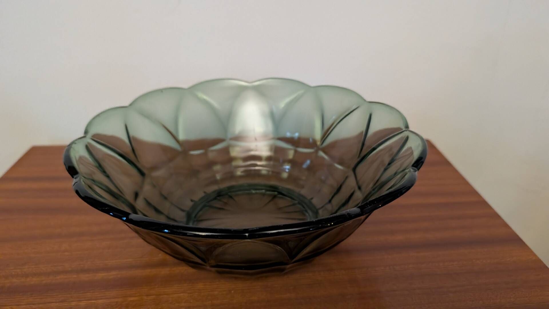 Vintage green smoked glass coupe with geometric decoration.