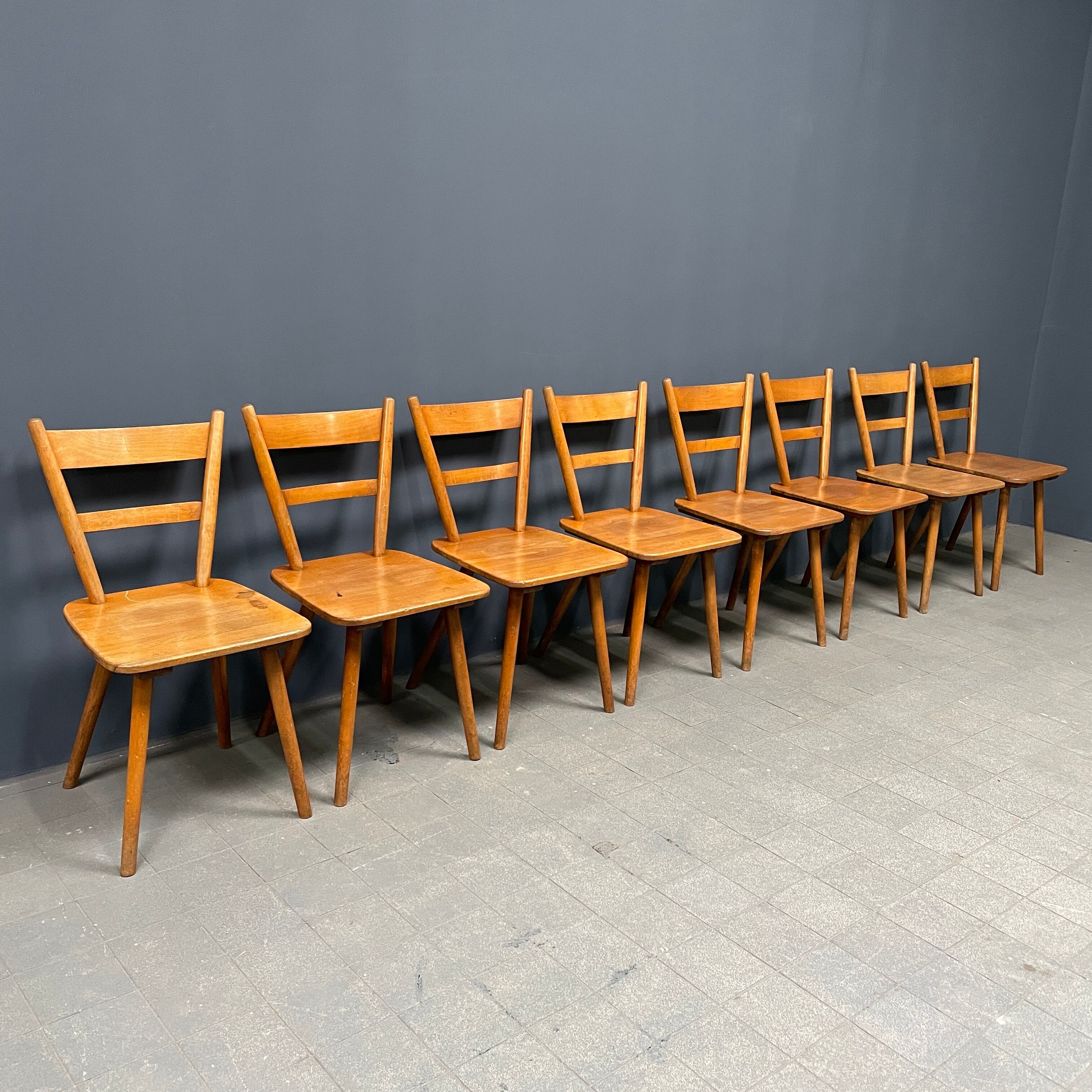 Set of eight german stick chairs from the 1950