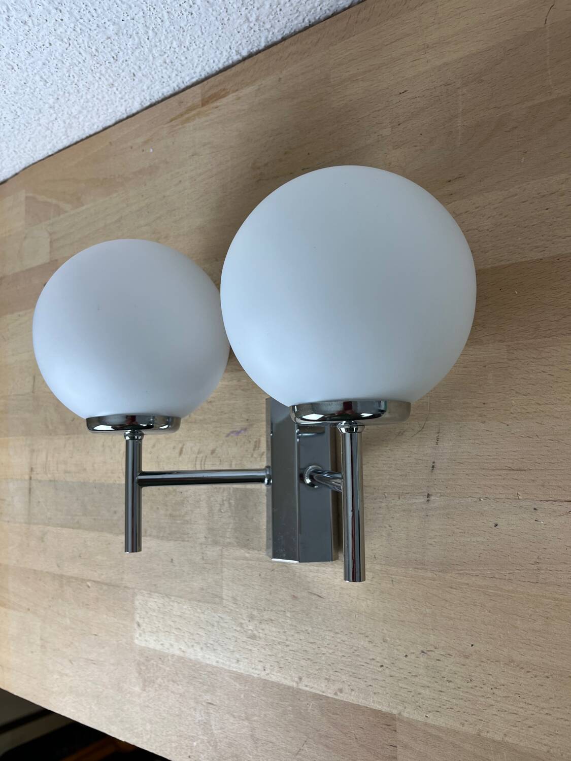 Opaline and chrome globe wall light from the 1970s