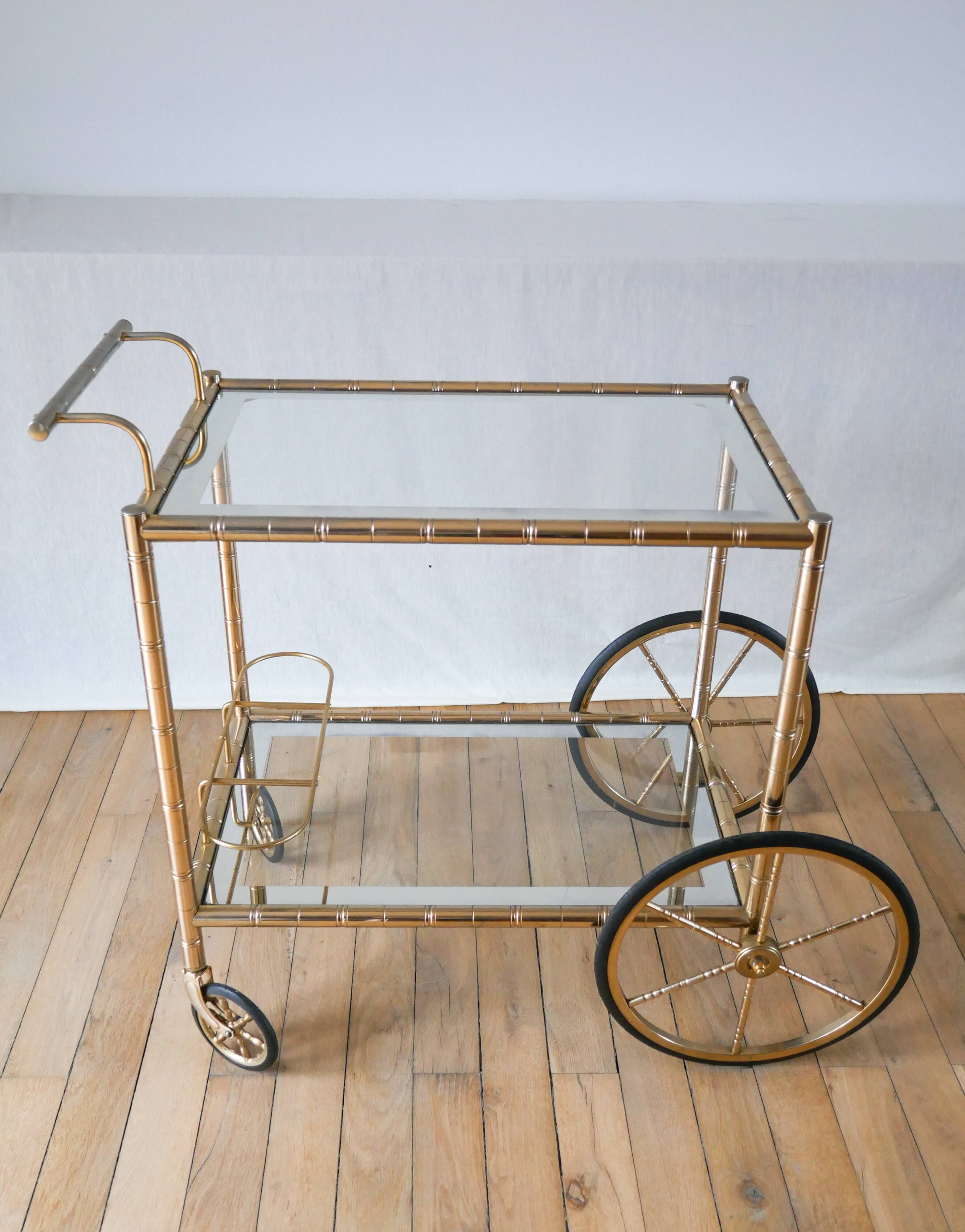 Serving table in gilded metal and glass with large wheels 1950