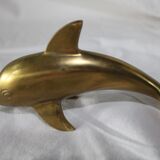 Family of dolphins in vintage brass