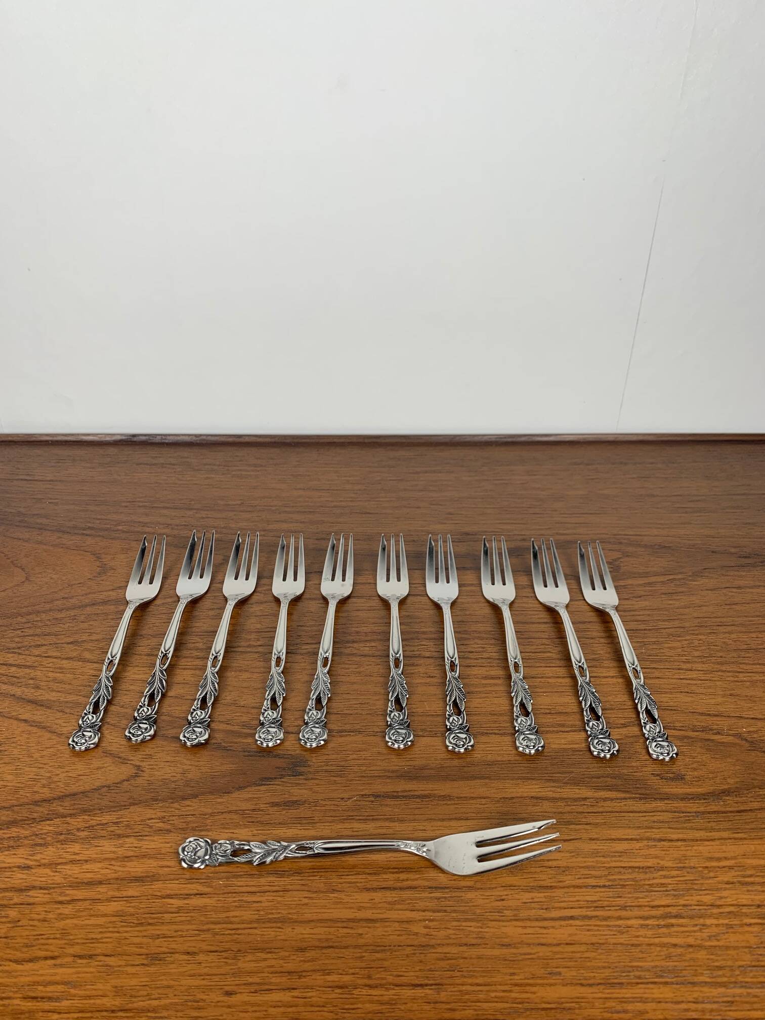 Set of 10+1 Japanese stainless steel dessert forks, rose pattern, 1970