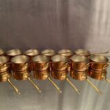 Suite of 12 tinned copper pans