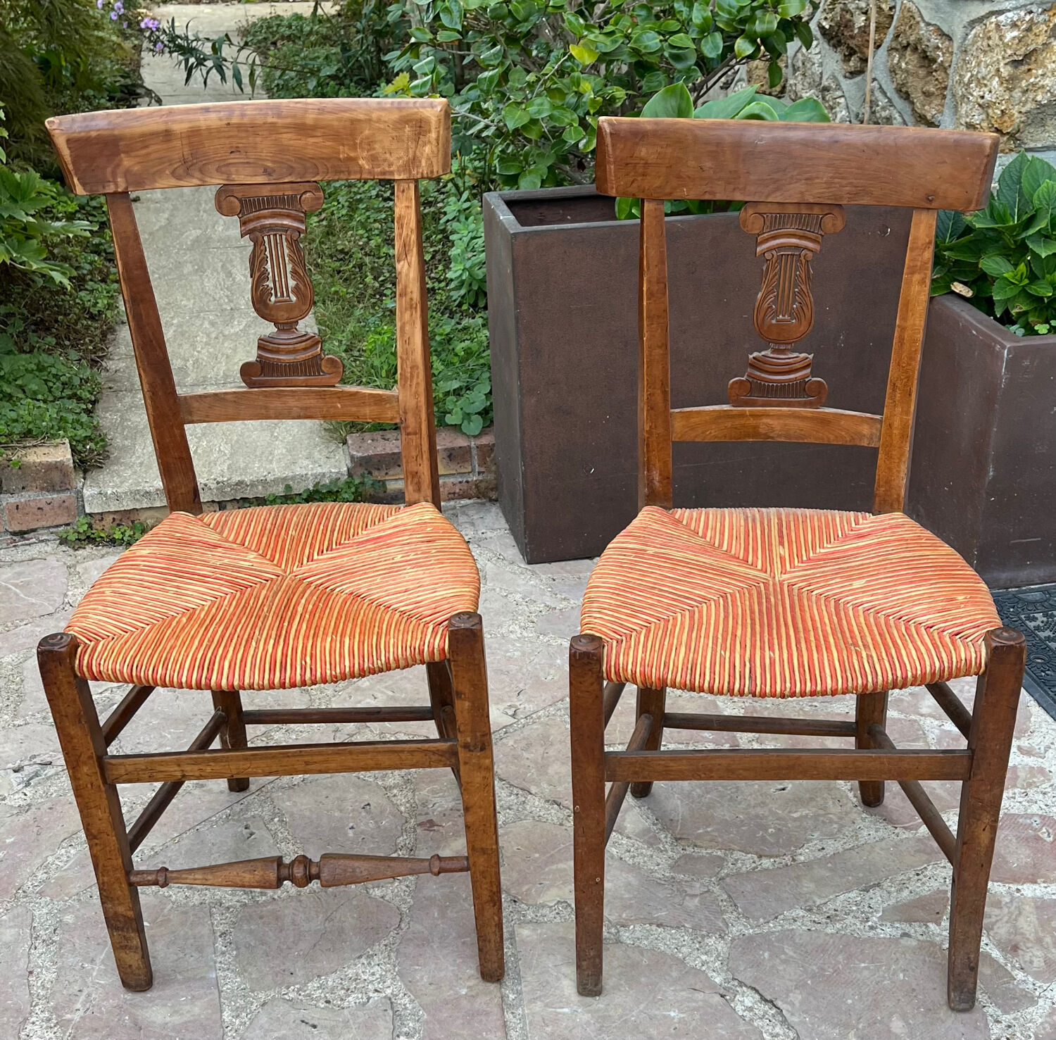 Pair of straw seated chairs