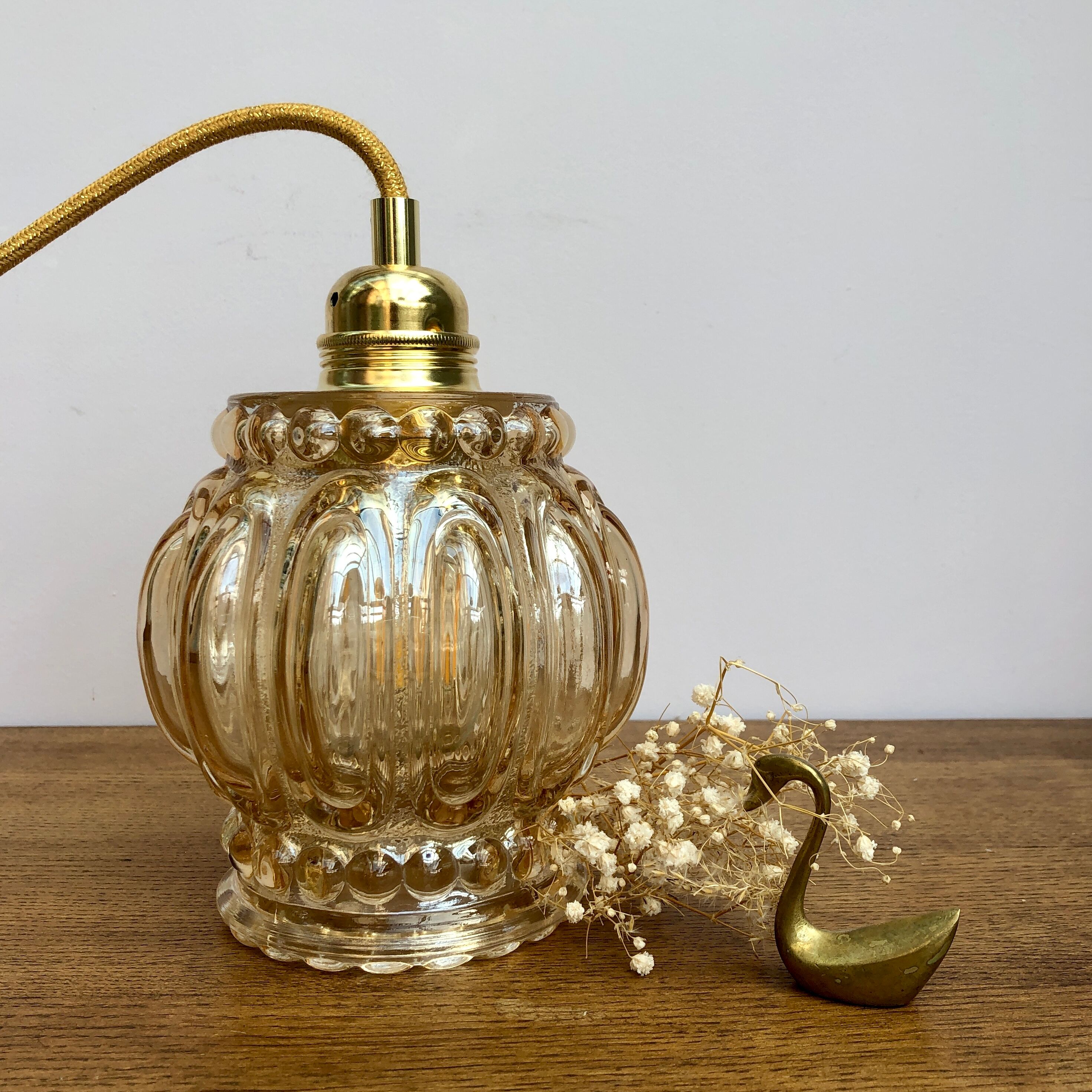Vintage amber glass globe hand lamp