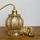 Vintage amber glass globe hand lamp