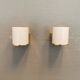 Wall lamps with milky white acrylic plastic shades and solid brass bases