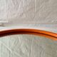 Vintage round wall mirror in orange painted wood - diameter: 48 cm