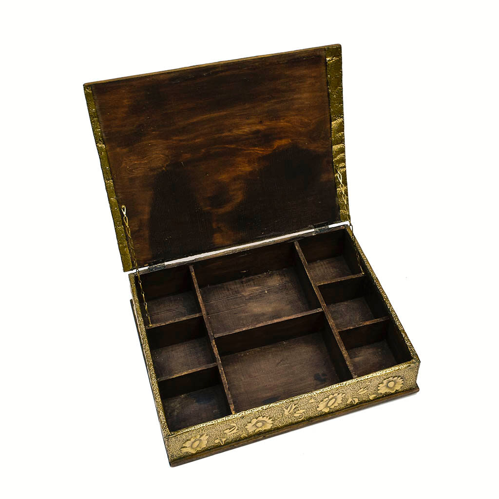 Old wooden box decorated with carved gold metal repelled vintage butterfly