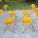 Série de 4 chaises pliantes métal doré et tissus